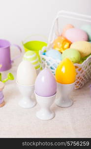 Easter decorations - egg candles, basket and birdhouse