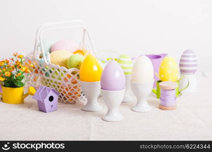 Easter decorations - egg candles, basket and birdhouse