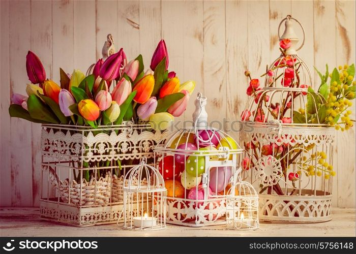 Easter decorations - shabby chic birdcages with flowers and eggs. Easter birdcage