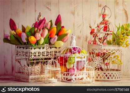 Easter decorations - shabby chic birdcages with flowers and eggs. Easter birdcage