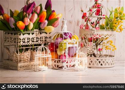 Easter decorations - shabby chic birdcages with flowers and eggs. The Easter birdcage