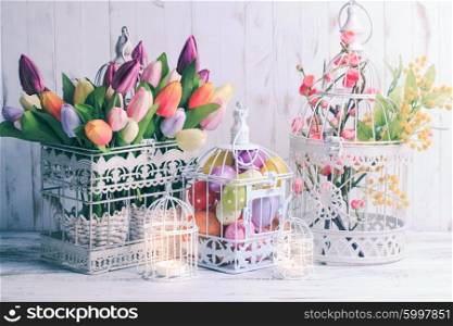 Easter decorations - shabby chic birdcages with flowers and eggs. The Easter birdcage