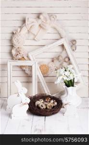 Easter decorations - shabby chic white rabbits and wreath. Easter decorations