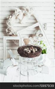 Easter decorations - shabby chic white rabbits and wreath. The Easter decorations
