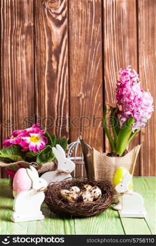 Easter decorations - white shabby chic bunnies and spring flowers. Easter bunnies