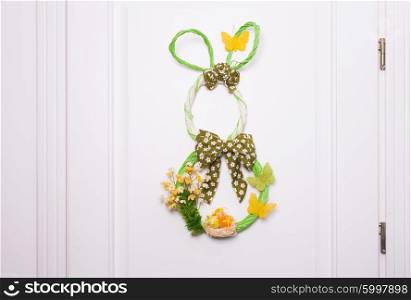 Easter decorations - wicker bunny on the door. Door Easter decorations