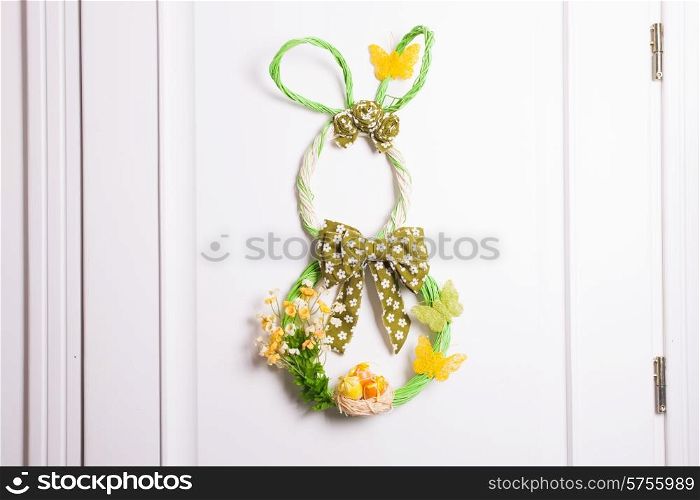 Easter decorations - wicker bunny on the door. wicker bunny
