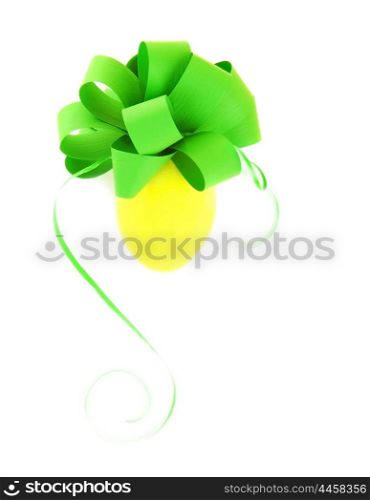 Easter egg decorated with festive green bow isolated on white background