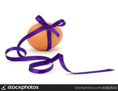 Easter egg with festive bow isolated on white background