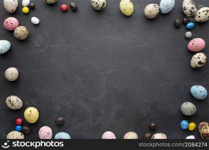 easter eggs frame with candy slate background