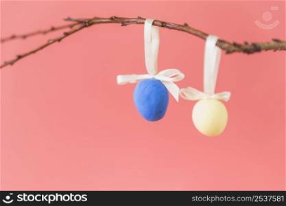 easter eggs hanging twig
