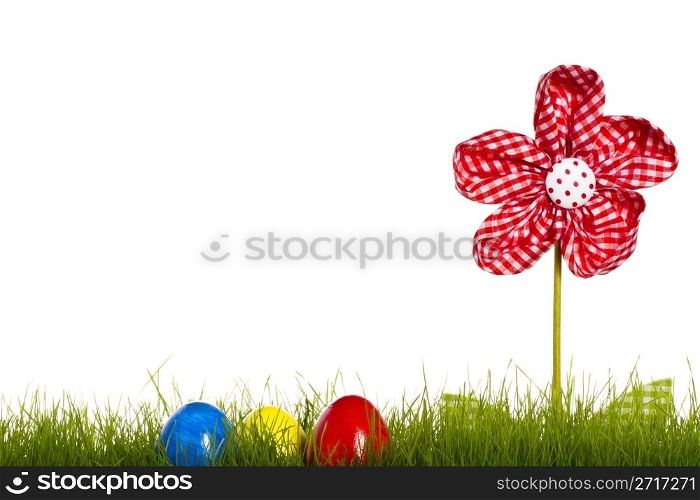 easter eggs in grass with drapery flower. easter eggs in grass with drapery flower on white background
