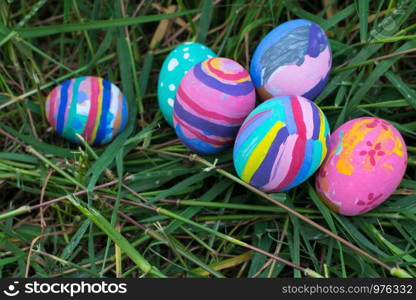 Easter eggs in Green Grass. Selective focus.