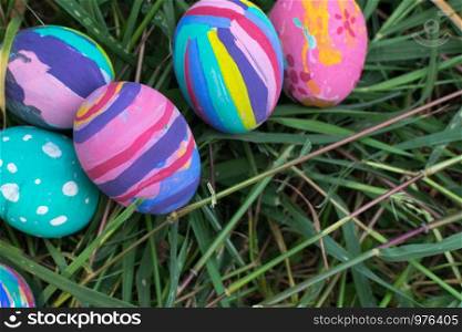 Easter eggs in Green Grass. Selective focus.