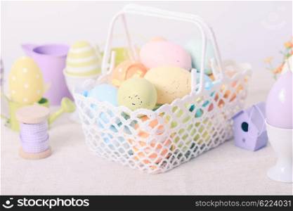 Easter eggs in the white crochet basket. The Easter basket