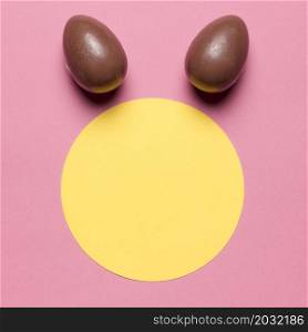easter eggs like bunny ear s round paper blank frame against pink backdrop