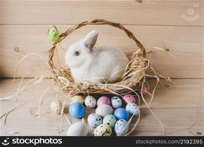 easter eggs near rabbit basket