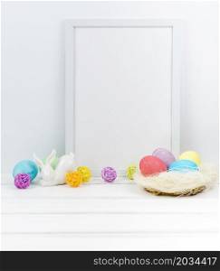easter eggs nest with blank frame table