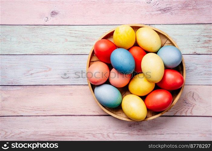 Easter eggs on pink wooden background with copy space. Easter eggs on pink background