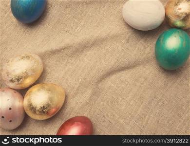 Easter eggs on table. Holiday background. Tinted photo.