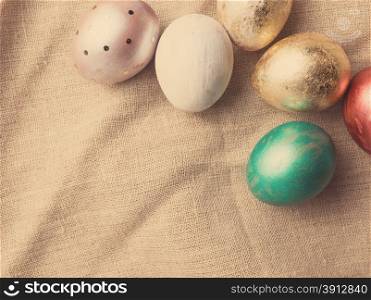 Easter eggs on table. Holiday background. Tinted photo.