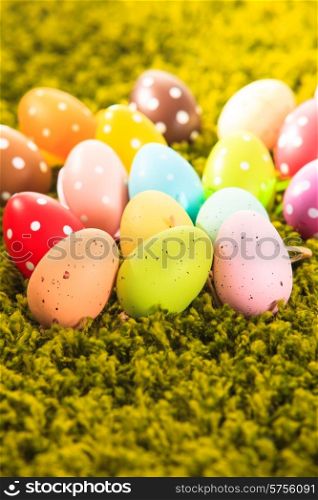 Easter eggs on the grass carpet, holiday decorations