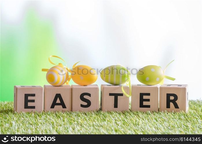 Easter eggs on the word easter in the garden