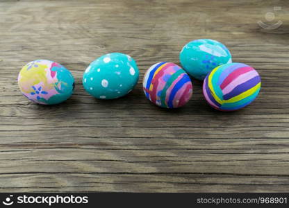 Easter eggs on wooden background. Selective focus.