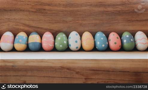 Easter eggs on wooden background with vintage tone.