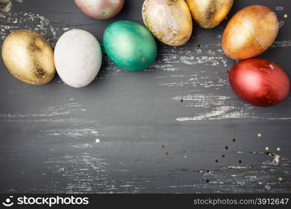 Easter eggs on wooden table. Holiday background