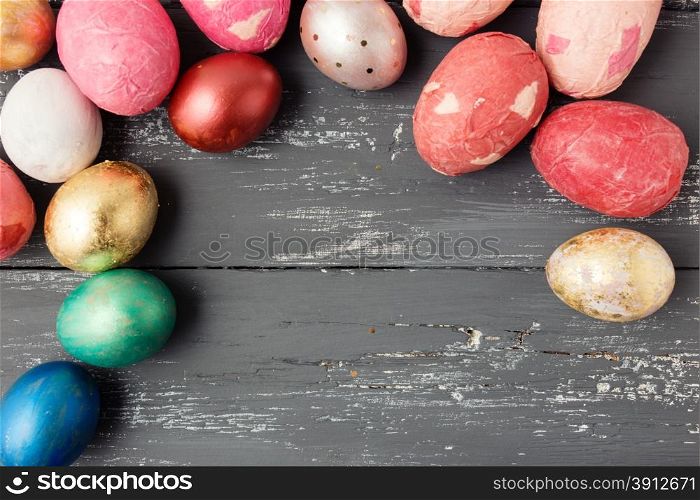 Easter eggs on wooden table. Holiday background
