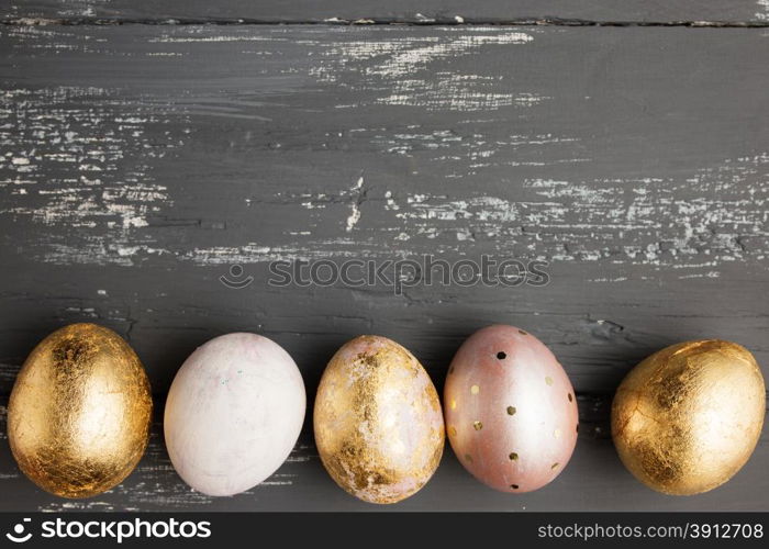 Easter eggs on wooden table. Holiday background