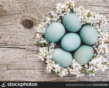 Easter eggs painted with colorful paints. View from above, no people, texture. Congratulations for loved ones, relatives, friends and colleagues. Easter eggs painted with colorful paints. View from above