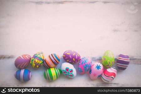 Easter eggs painting decorated on pastel wooden backgrounds with copy space for April Easter day with copy space