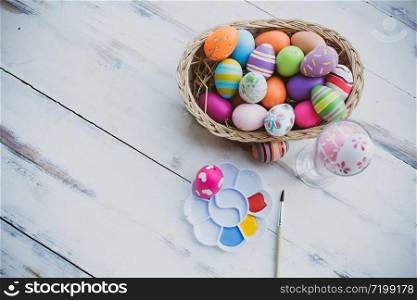 Easter eggs painting decorated on pastel wooden backgrounds with copy space for April Easter day