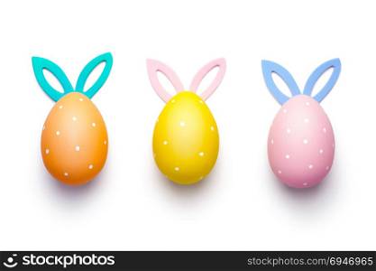 Easter eggs with bunny ears isolated on white background. Top view