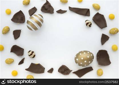 easter eggs with chocolate pieces white table