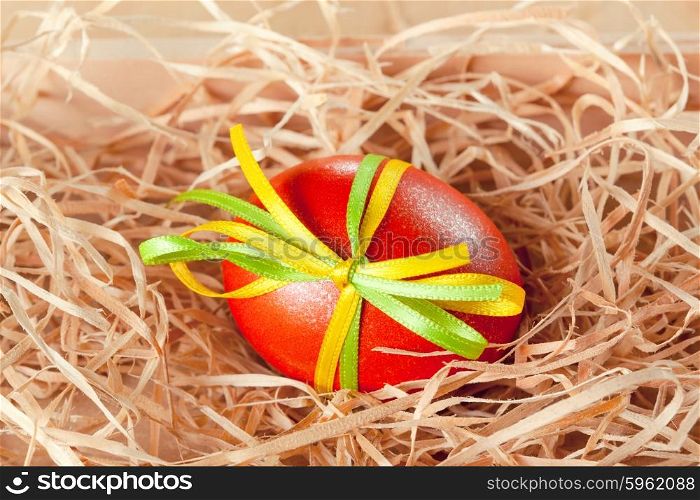 easter eggs with ribbon in the nest