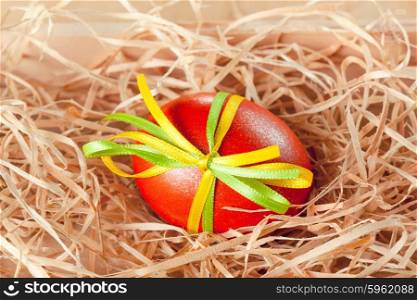 easter eggs with ribbon in the nest