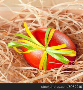 easter eggs with ribbon in the nest