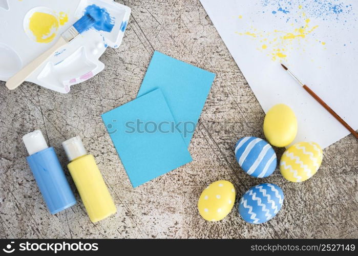 easter eggs with small papers glue sticks table