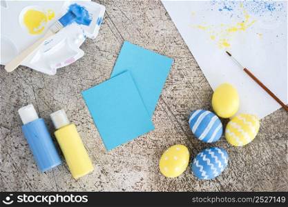 easter eggs with small papers glue sticks table