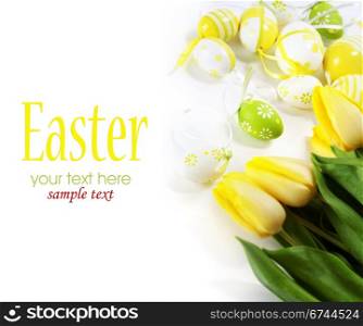 easter eggs with yellow tulip flowers isolated on white background (with sample text)