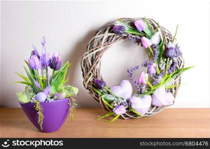 Easter floral home decoration on the table. Homemade arrangement.
