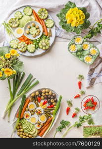 Easter food background. Various meals plates with boiled eggs. Easter lunch. Top view