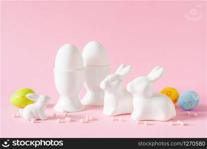 Easter holiday decorations on pink background, festive greeting card