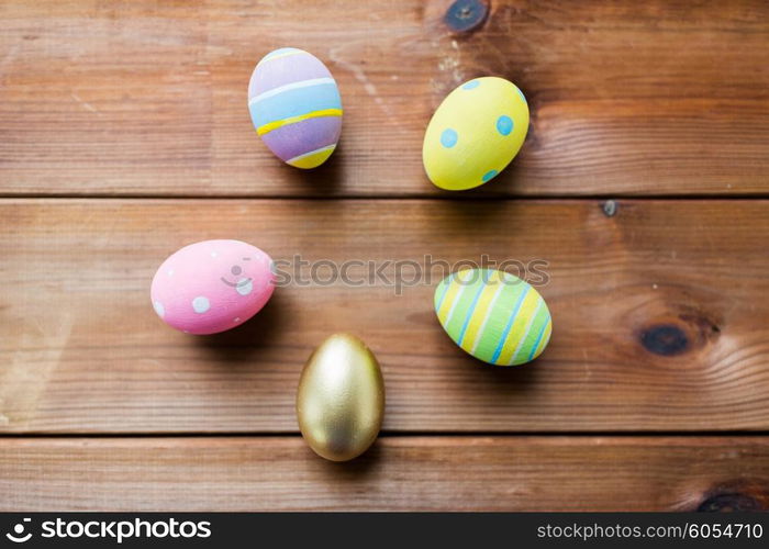 easter, holidays, tradition and object concept - close up of colored easter eggs