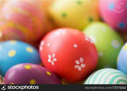 easter, holidays, tradition and object concept - close up of colored eggs. close up of colored easter eggs