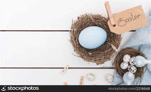 easter inscription with blue egg nest