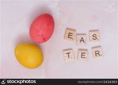 easter inscription with colorful eggs